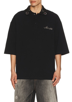 Amiri Stud Collar Oversized Polo in Black - Black. Size M (also in L, S, XL/1X, XXL/2X).