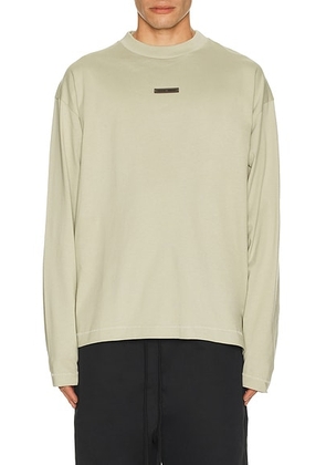 Fear of God ESSENTIALS Classic Fit Long Sleeve Tee in Abbey Stone - Grey. Size M (also in L, XL/1X).