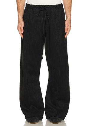 Fear of God ESSENTIALS Flare Pant in Vintage Black - Black. Size M (also in XS, S, L, XL/1X, XXL/2X).