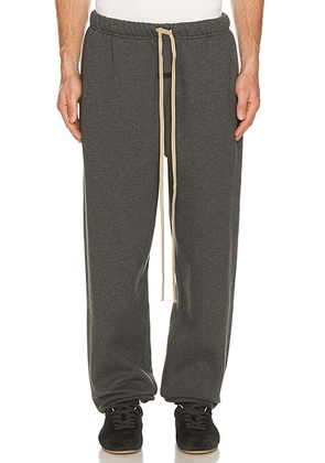 Fear of God ESSENTIALS Classic Sweatpant in Charcoal Heather - Black. Size M (also in L, XL/1X, XXL/2X).