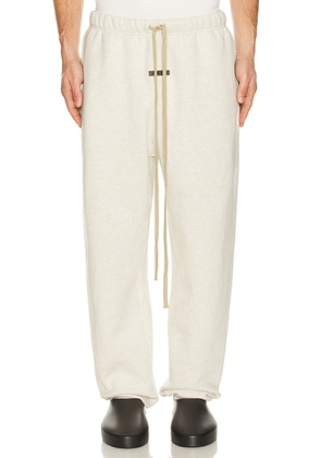 Fear of God ESSENTIALS Classic Sweatpant in Oatmeal Heather - Grey. Size M (also in L, XL/1X, XXL/2X).