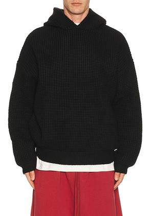 Fear of God ESSENTIALS Heavy Waffle 90'S Hoodie in Vintage Black - Black. Size M (also in XS, S, L, XL/1X).