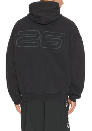 Fear of God ESSENTIALS 90'S Hoodie in Vintage Black - Black. Size M (also in XS, S, L, XL/1X, XXL/2X).