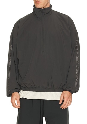 Fear of God ESSENTIALS Half Zip Track Jacket in Iron Grey - Grey. Size M (also in S, L, XL/1X).
