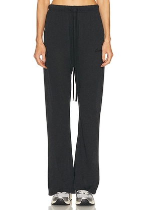Fear of God ESSENTIALS Flare Pant in Vintage Black - Black. Size M (also in XXS, XS, S, L, XL).