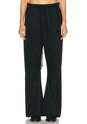 Fear of God ESSENTIALS Flare Pant in Vintage Black - Black. Size M (also in XS, S, L).