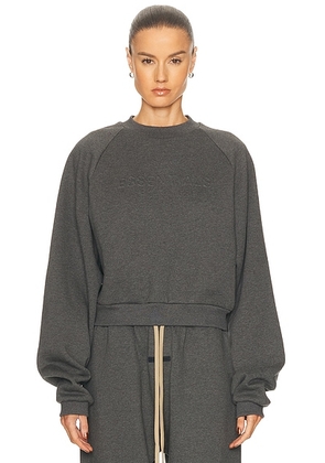 Fear of God ESSENTIALS 90's Raglan Sweatshirt in Charcoal Heather - Charcoal. Size M (also in L, S, XL, XS, XXS).