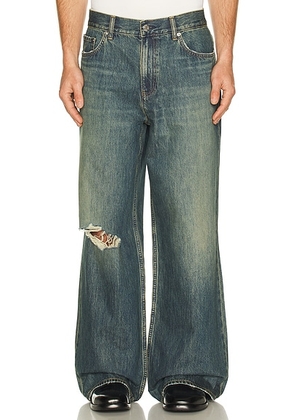 Helmut Lang Destroyed Denim in Tinted Vintage Blue - Blue. Size 30 (also in 31, 33, 34).