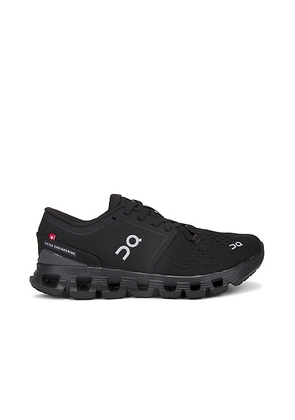 On Cloud X 4 Sneaker in Black & Eclipse - Black. Size 5 (also in 10, 5.5, 6, 6.5, 7, 7.5, 8, 8.5, 9, 9.5).
