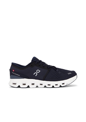 On Cloud X 4 Sneaker in Ink & Ivory - Navy. Size 7.5 (also in ).