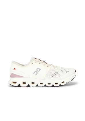 On Cloud X 4 Sneaker in Ivory & Heron - White. Size 9.5 (also in 10, 5, 5.5, 6, 6.5, 7, 7.5, 8, 8.5, 9).