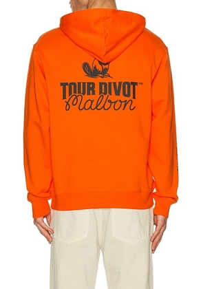 Malbon Golf Fesque Tour Divot Hoodie in Flame & Bark Camo - Orange. Size L (also in S, M, XL/1X).