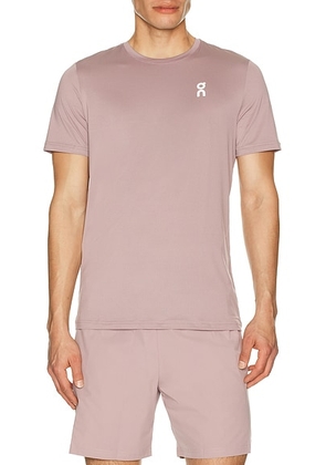 On Core-T in Heron - Mauve. Size M (also in L, XL/1X, S).