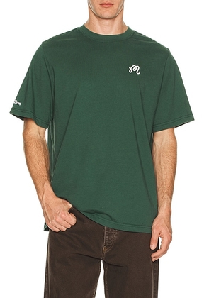 Malbon Golf Bermuda Tee in Forest - Green. Size L (also in S, M, XL/1X).