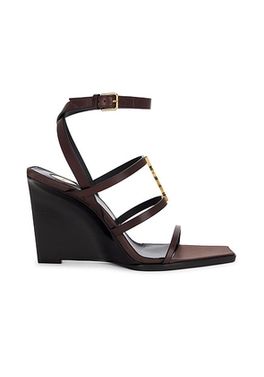 Saint Laurent Cassandra Wedge Sandal in Ultra Dark Brown - Brown. Size 36.5 (also in 37, 36, 37.5, 38.5, 39, 40, 41, 38).
