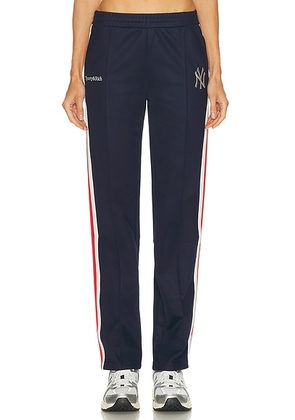 Sporty & Rich X NY Yankees Serif Track Pant in Dark Navy  White  & Fire Red - Navy. Size XS (also in L).