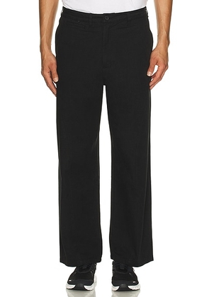 Students Golf Beverly Baggy Chino Pants in Black - Black. Size 34 (also in 32).