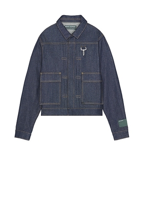 Reese Cooper Concealed Button Trucker Jacket in Undone Denim - Blue. Size S (also in XL/1X).