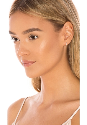 EF COLLECTION Diamond Mini Huggie in Metallic Gold.