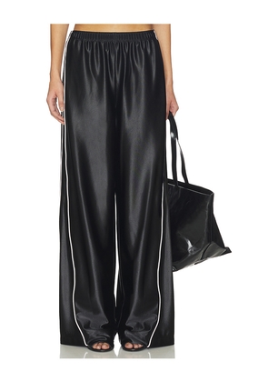 Alexander Wang Track Pant With Reflective Piping in Black. Size M. Also in S, XS.