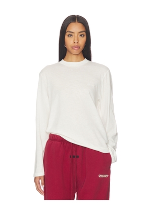 Fear of God ESSENTIALS Classic Fit Long Sleeve Tee in Ivory. Size M. Also in L, S, XS.