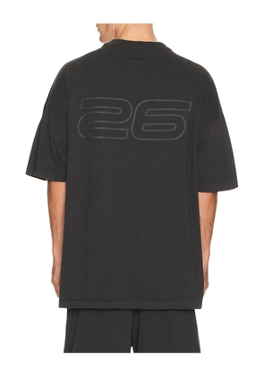 Fear of God ESSENTIALS 90'S Short Sleeve Tee in Black. Size M. Also in L, S, XL/1X, XS, XXL/2X.