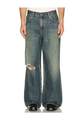 Helmut Lang Destroyed Denim in Blue. Size 30. Also in 31, 33, 34.