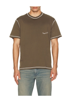 Museum of Peace and Quiet Wordmark Reverse Stitched T-Shirt in Brown. Size M. Also in XS, S, L.