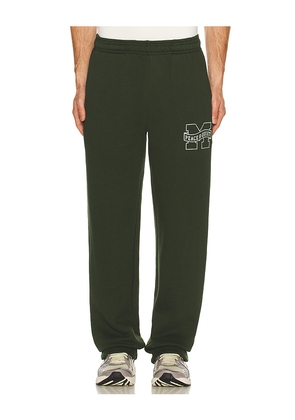 Museum of Peace and Quiet Banner Sweatpants in Green. Size M. Also in XS, S, L.
