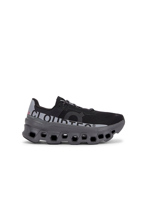On Cloudmonster Lumos Sneakers in Black. Size 5. Also in 6, 6.5, 7, 7.5, 8, 8.5, 9, 9.5.