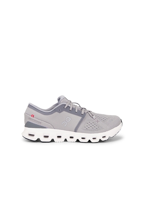 On Cloud x 4 in Grey. Size 10.5. Also in 7, 7.5, 8, 8.5, 9, 9.5, 10, 11, 11.5, 12, 12.5, 13.