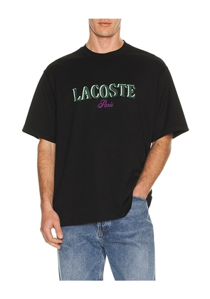Lacoste Loose Fit Logo Tee in Black. Size 4. Also in 3, 5, 6.