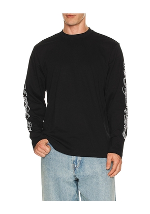 Stampd LA Cursive Long Sleeve Relaxed Tee in Black. Size M. Also in S, L, XL/1X.