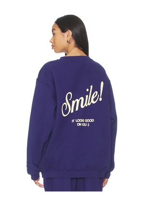 The Mayfair Group Smile Oversized Crewneck Sweatshirt in Purple. Size S/M. Also in XS, L/XL.