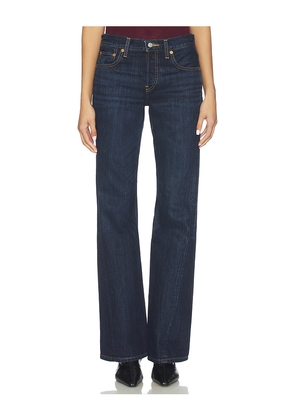 RE/DONE Twisted Mid Rise Bootcut Jeans in Blue. Size 25. Also in 26, 27, 28, 29, 30, 31, 32.