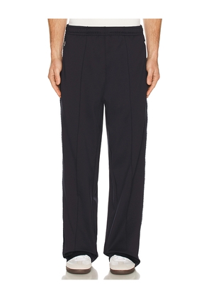 Palmes Tricot Track Pants in Navy. Size M. Also in S, L.