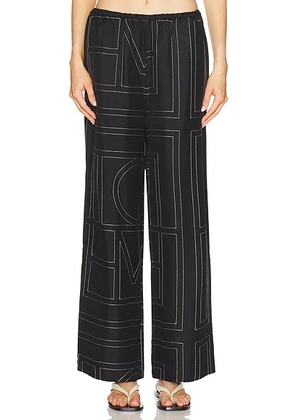 Toteme Monogram Silk PJ Bottom in Black - Black. Size 32 (also in 34, 36, 38, 42).
