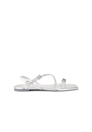 SIMKHAI Carey Metallic Strappy Flat Sandal in Metallic Silver, grey. Size 39. Also in 40.