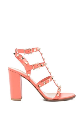 Valentino Garavani Rockstud studded strap sandals - Orange