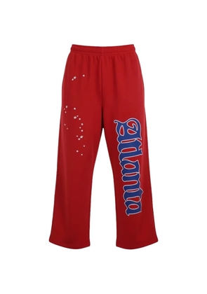 SP5DER atlanta-print track pants - Red