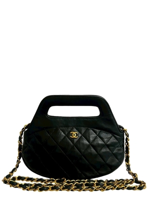 CHANEL Pre-Owned 1989-1991 CC Quilted Lambskin Top Handle Round Frame Bag satchel - Black