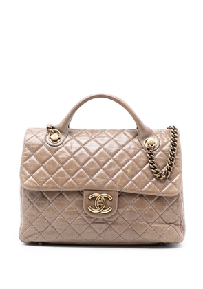 CHANEL Pre-Owned 2013-2014 Large Glazed Calfskin Castle Rock Top Handle Flap satchel - Brown