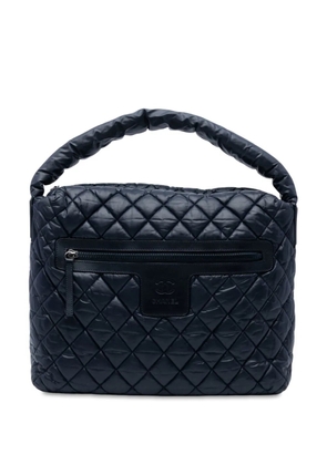 CHANEL Pre-Owned 2009-2010 Quilted Nylon Coco Cocoon Hobo handbag - Blue