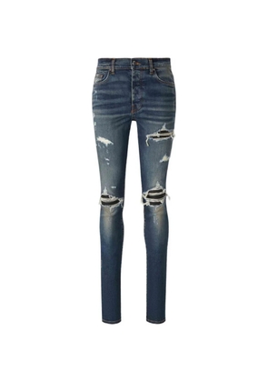 AMIRI distressed-details skinny jeans - Blue