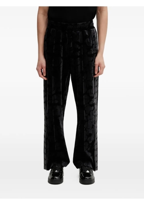 A BATHING APE® camouflage-pattern trousers - Black