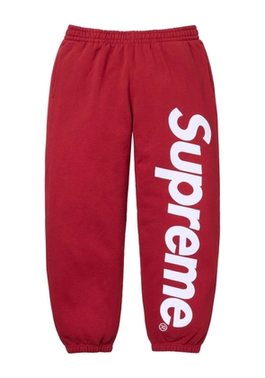 Supreme satin-appliqué track pants - Red