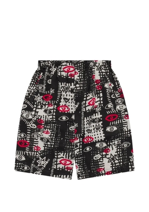 Black Comme Des Garçons printed shorts