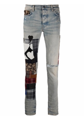 AMIRI patchwork-detail denim jeans - Blue