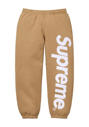 Supreme satin-appliqué track pants - Brown