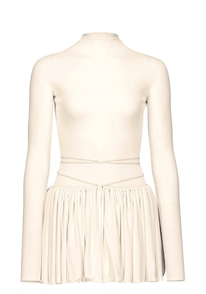 ALAÃA ALAÎªA Peplum Top in Panna Cotta - White. Size 38 (also in 40).